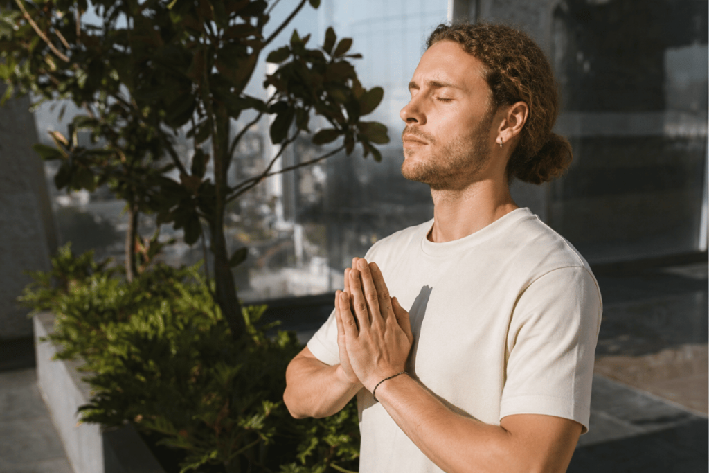 Man practicing slow, deep breathing outdoors to support oxygen intake and overall wellness.